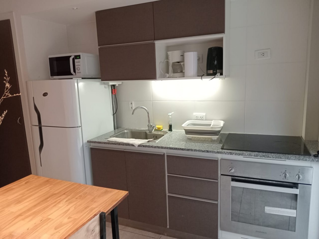 DEPARTAMENTO CON PATIO , EDIFICIO FRENTE AL MAR 